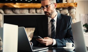 man-in-black-holding-phone