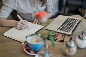 Close up of woman with a notebook