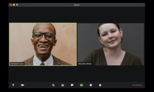 Close-up view of two people engaged in a Zoom video conference in default setting, Gallery View